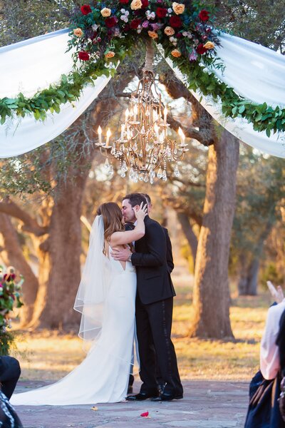 real Ma Maison wedding couple kissing at altar