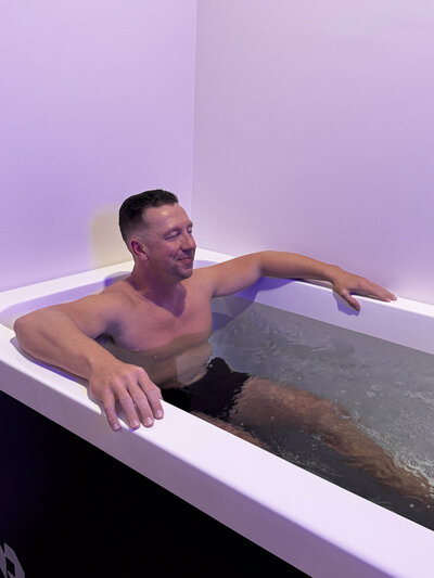 man in cold plunge tub