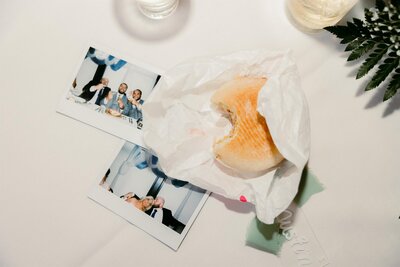 Reception flat lay with polaroids.