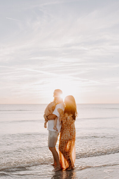 couple holding eachother in the ocean