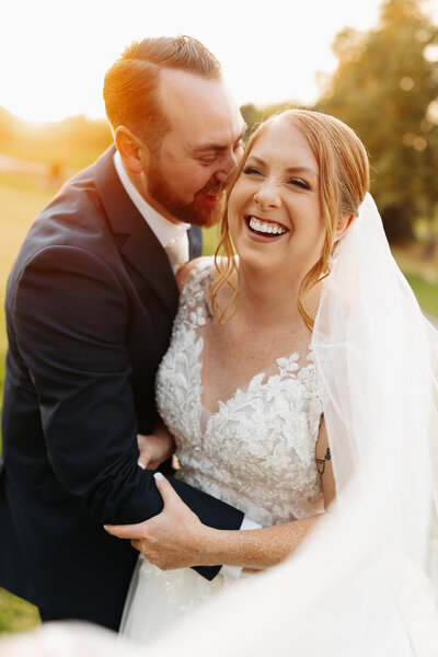 Bride and Groom looking at each other smiling