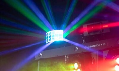 GigBAR Move light fixture projecting vibrant coloured beams across the wedding dance floor