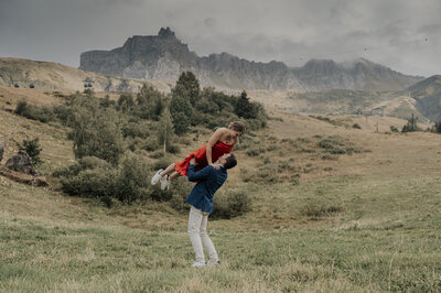 couple kissing and eloping on a mountain in the french alps