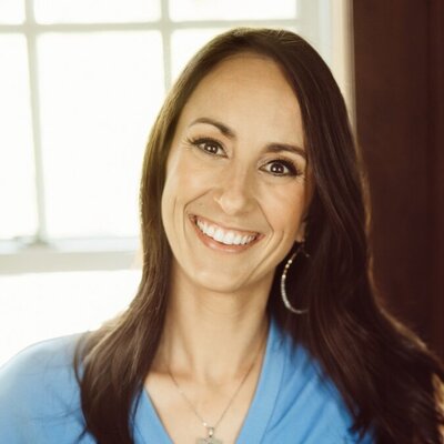 Sonya Looney in a blue shirt in front of a window