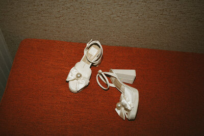 detail photo of bride and groom wedding shoes