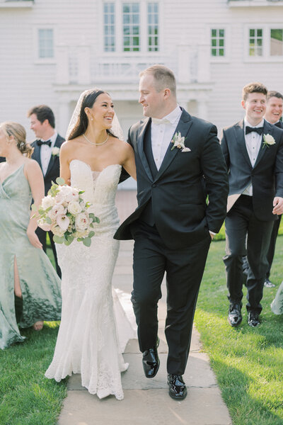 Wedding party share a few joyful moments at sunset together at the beautiful Ryland Inn captured by NJ Wedding Photographers | Michelle Behre