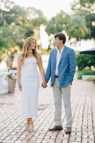 an engaged Georgia couple holding hands