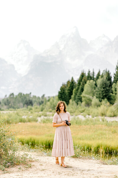 Anna Standing in front of the Grand Tetons at Schwabacher Landing in Moose Wyoming