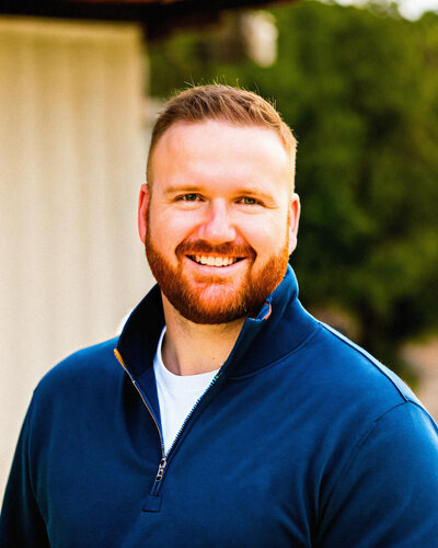 Portrait of Jace Tarbell, founder and luxury travel advisor at Somewhere Travel Co., offering bespoke travel planning for busy professionals.