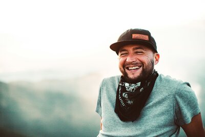 Overcoming Addiction Man Smiling on Hike