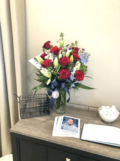 white and blue bouquet preserved in a hexagon shaped resin block