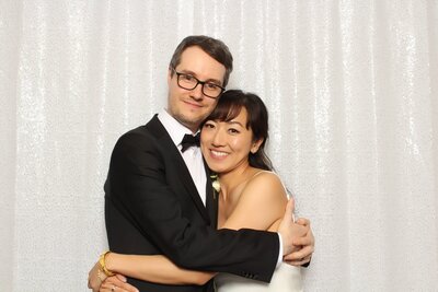 Couple using white sequin backdrop