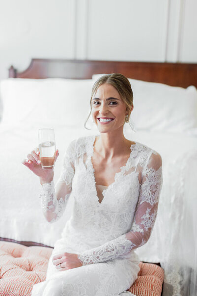 Colorado Bride waring lace, holding a drink