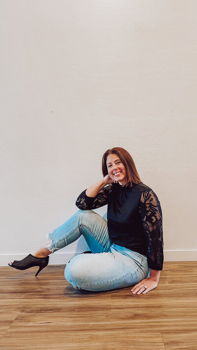 Founder Alli in black top with jeans
