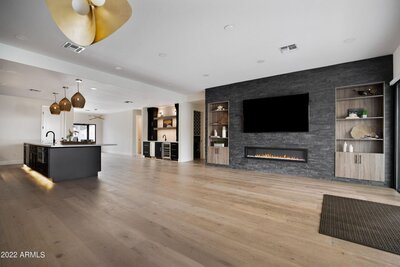 stacked stone by MSI, electric fireplace by Amantii, Engineered hardwood floors.