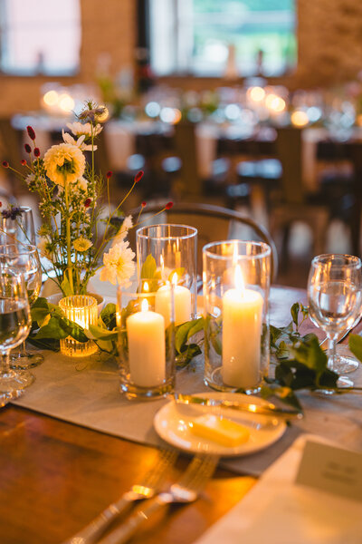 Candles on table at wedding reception (Unique Melody Events & Design helped with event at Mass MoCa