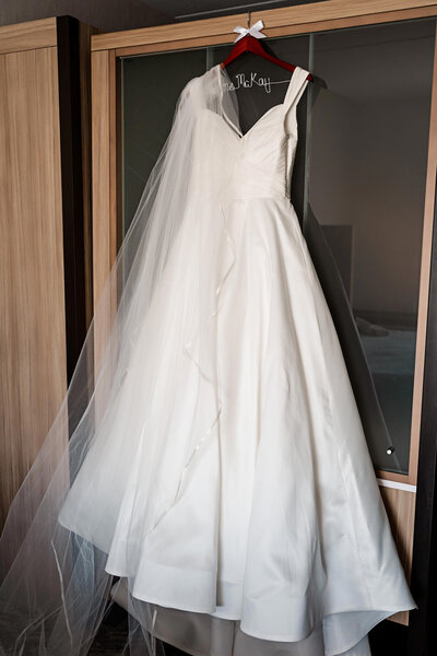 anne barge wedding dress hanging on wedding day