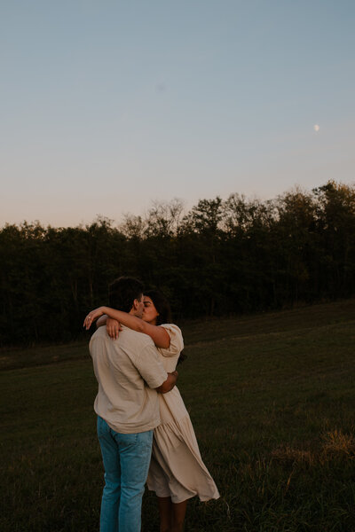 Romantic Omaha engagement session during the fall, captured by Tori Nichole Photography. The couple is surrounded by vibrant autumn foliage and golden light, creating warm, timeless moments. A perfect blend of natural beauty and authentic connection, showcasing the magic of the season and their love story.