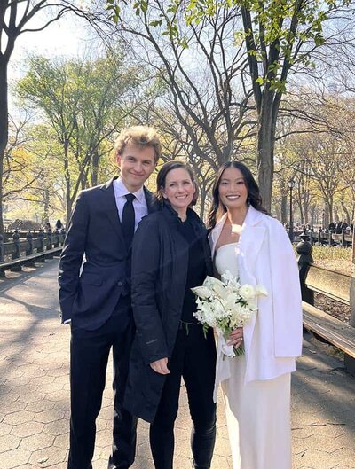 NYC Elopement photographer Kristy May with clients in Central park on their  wedding day
