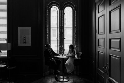 newlyweds sit and toast