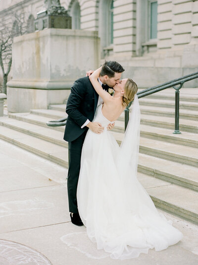 Bride and groom walk up memorial steps at their DC wedding