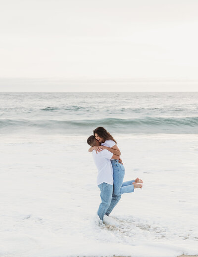 couple hugging in the ocean