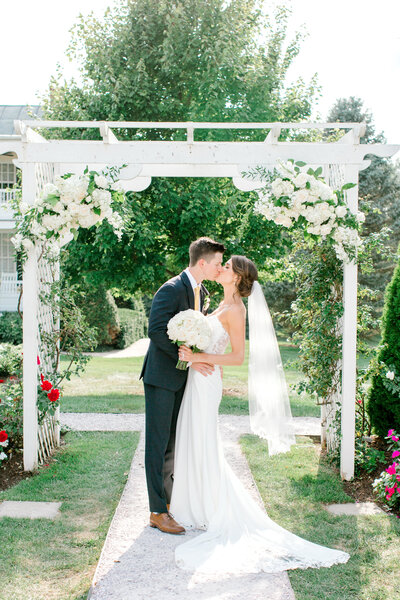 Couple celebrating their wedding day at the Kent Manor. Wedding venue located in Kent Island, Maryland. Black and white image taken by Baltimore wedding photographer, Jenna Davis