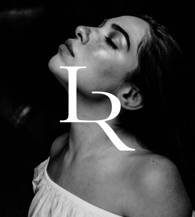 Black and white image of a woman looking up with her eyes closed, with the Le Rouge sub mark logo overlayed in white text