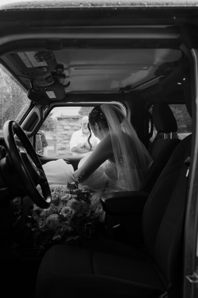 bride sitting in an old classic truck