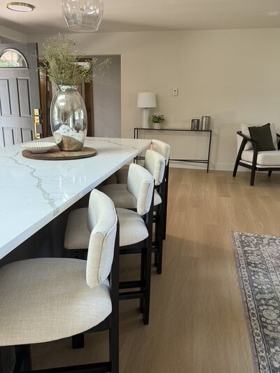 Open-concept kitchen design with stone countertops and natural textures.