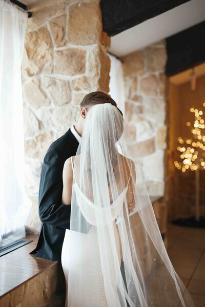 Bride and groom making grand entrance into the ballroom . Black and white photo