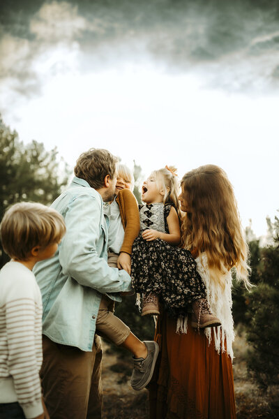 family plays and cuddles during family photo session