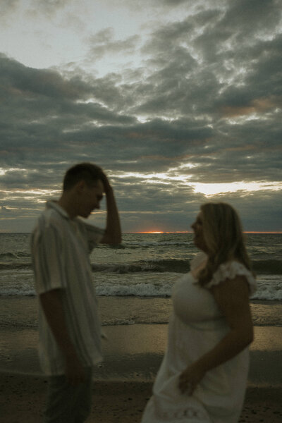 Editorial engagement photos on Lake Michigan at dusk. 