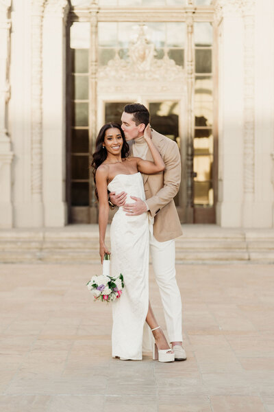 bride and groom stop for a quick pose on the streets of beverly hills