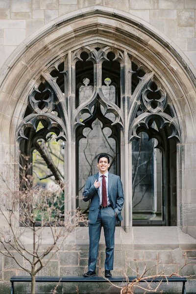 Mom in a denim jacket hugging her young daughter in a field of yellow grass