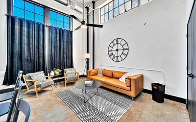 Living area seating in this one-bedroom, one-bathroom downtown luxury rental condo in the heart of Waco within walking distance to Waco's most popular shops, eateries & museums.