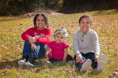 Children sitting and smiling