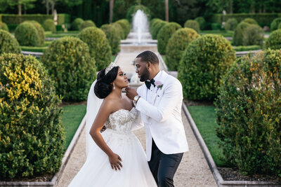 A black bride and groom pose for wedding portrait