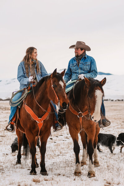 Cowboy couple on bay horses