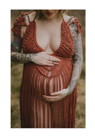 Pregnant woman holding her belly