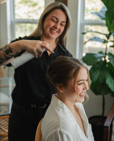 Stylist performing custom cut and color service on client at Lavender & Ink Studios in New Franken, WI