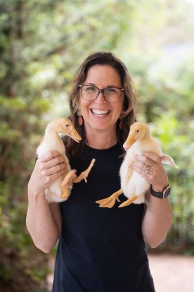 jill holding 2 baby ducks