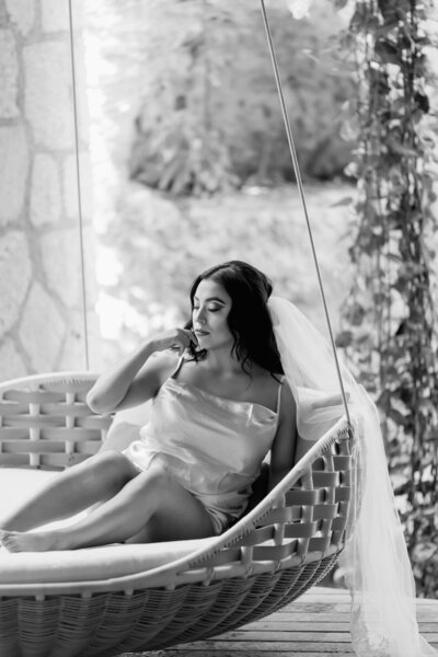black and white photo of bride in hammock