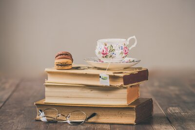photo-of-teacup-on-top-of-books-1831744