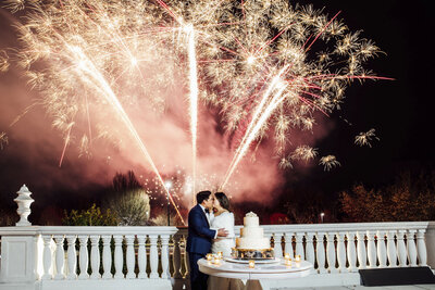 The Palace at Somerset Park | Bride and groom kissing under fireworks during winter wedding night photo | Somerset, New Jersey