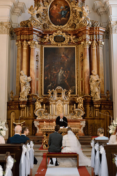 Luxury wedding in Europe – sophisticated bride in a modern wedding gown and groom in a timeless suit.