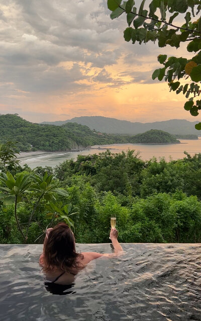 Anne looking at the view in a pool