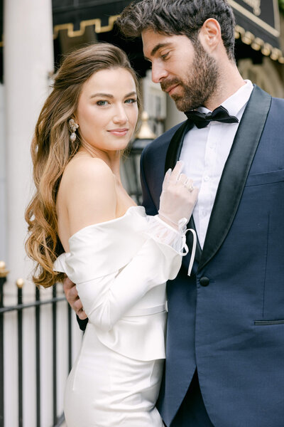 A wedding day photo of the couple in front of the Goring Hotel in London the United Kingdom