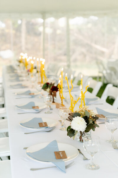 Wedding tablescape with wavy yellow candles