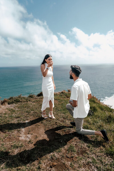 Engaged couple Nikhil and Pranali walking together during proposal photoshoot with mountain views, photographed by Zanthe Vorsatz.